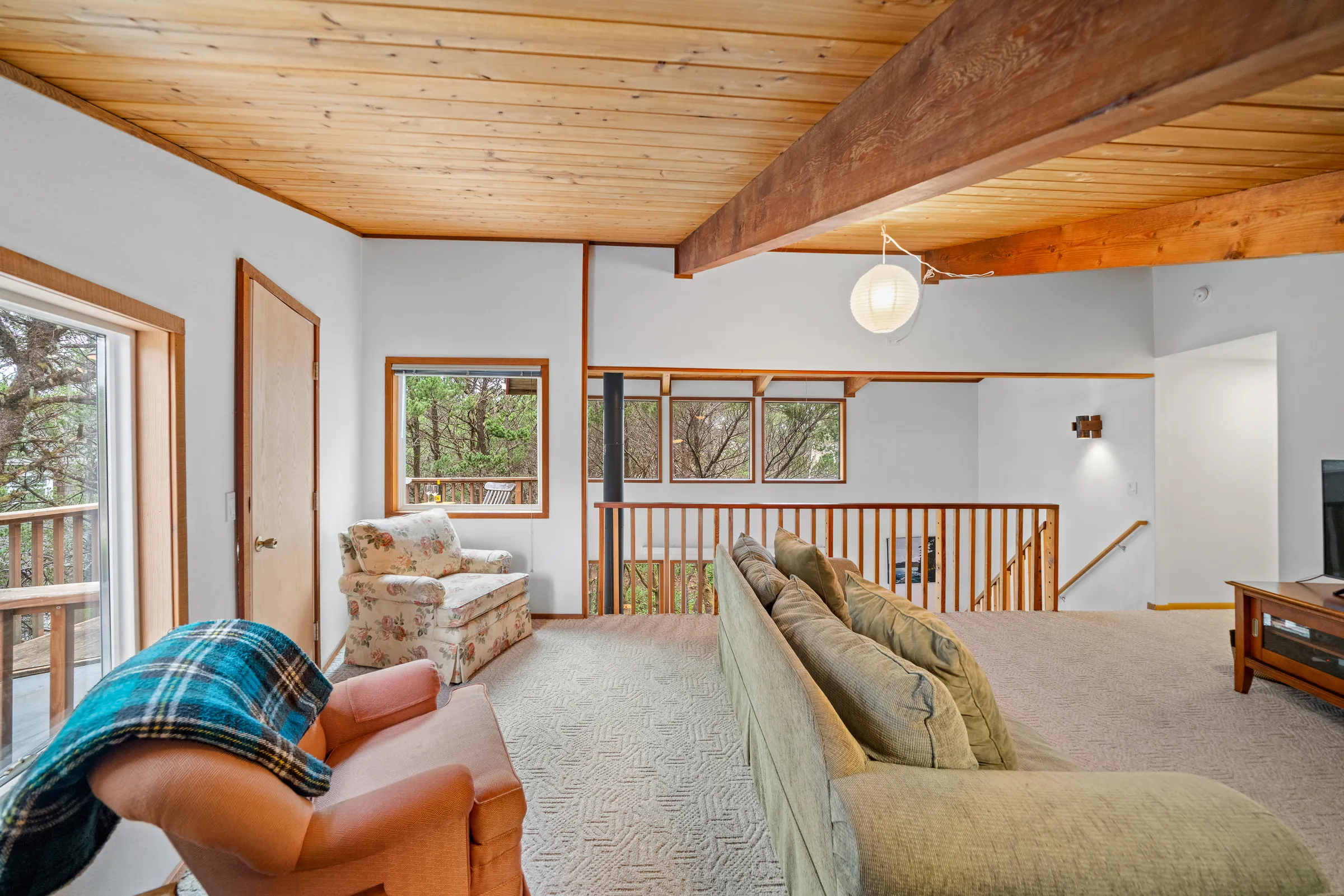 Loft with railing and tree views